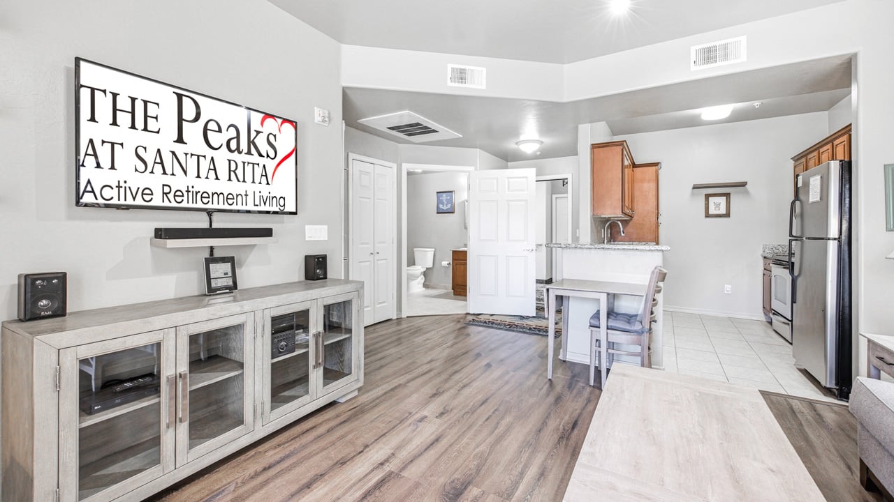 A living room in a The Peaks at Santa Rita apartment