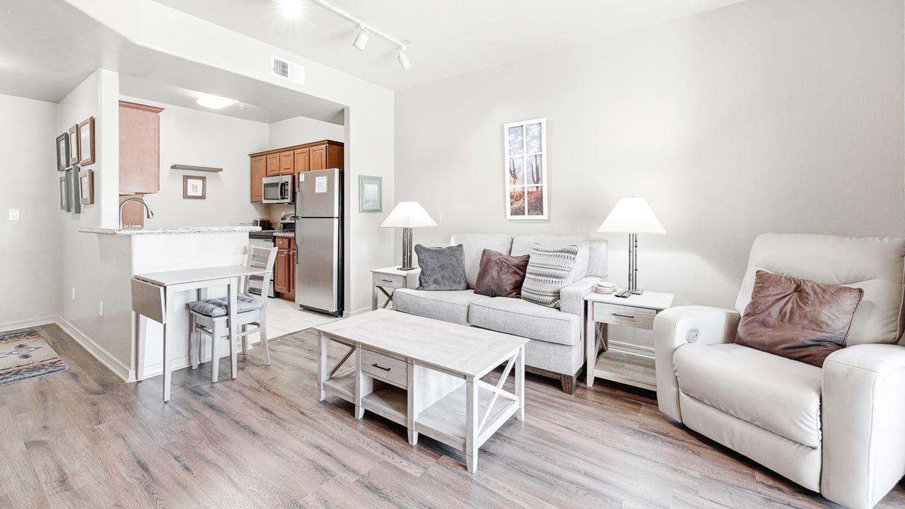 A living room in a The Peaks at Santa Rita apartment